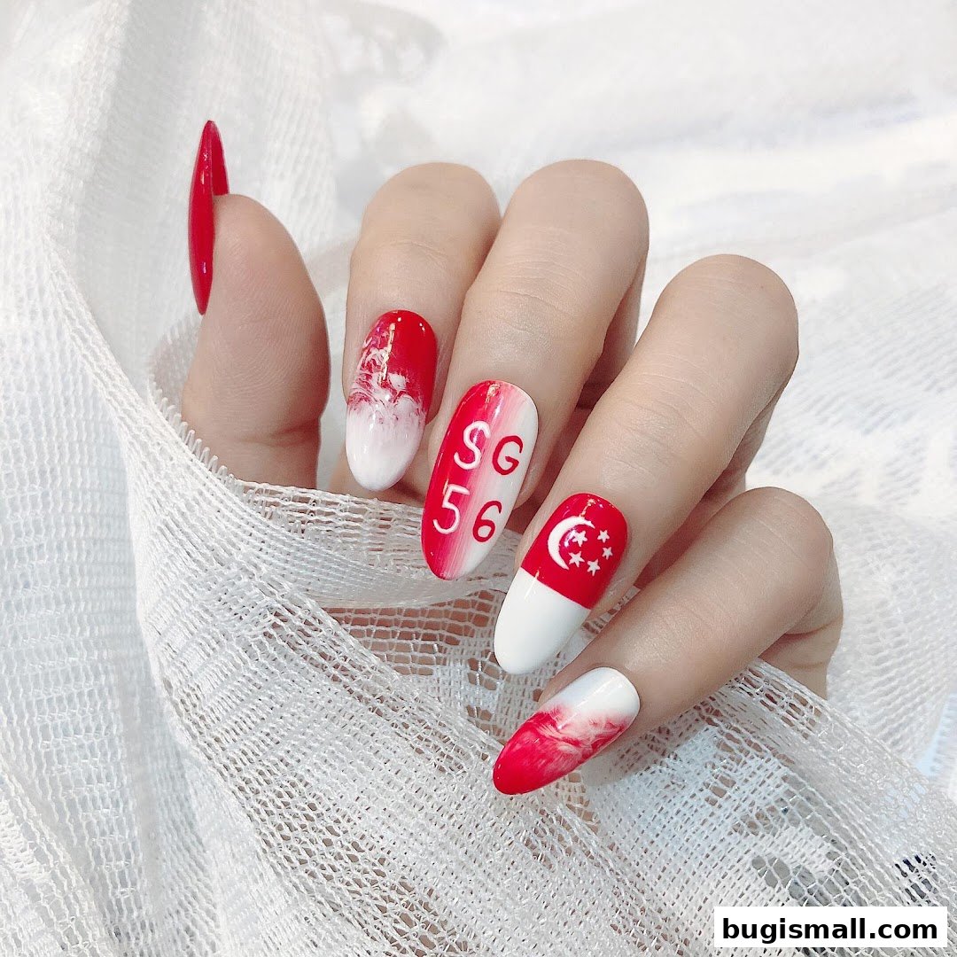 A hand with intricately designed nails featuring red and white patterns, the Singapore flag, and 'SG 56'.
