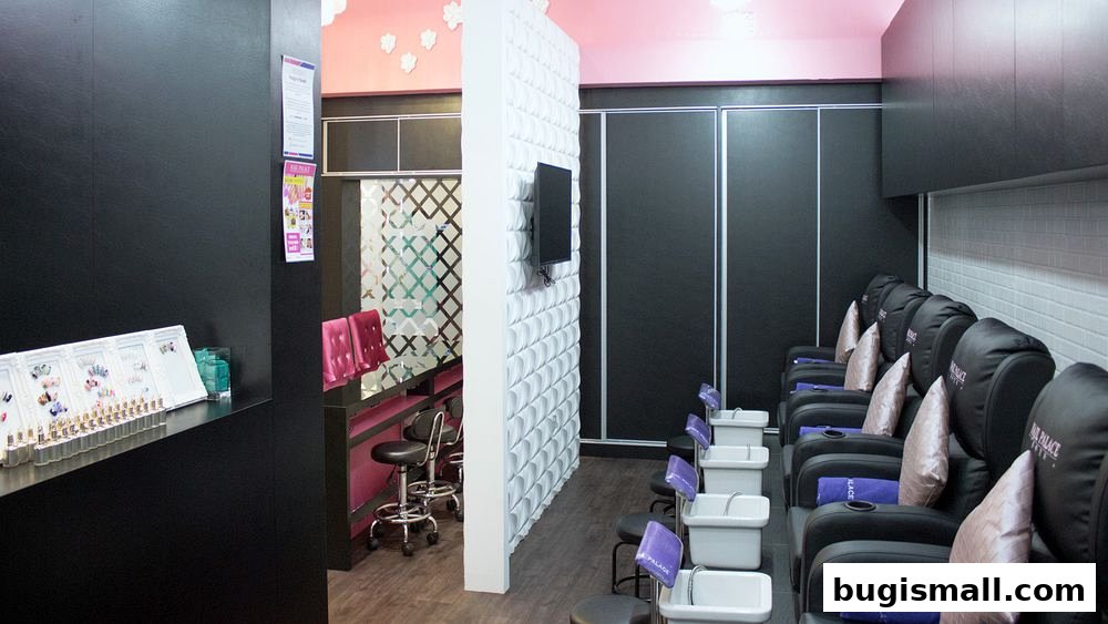 Interior of a nail salon with pedicure chairs and a reception area.
