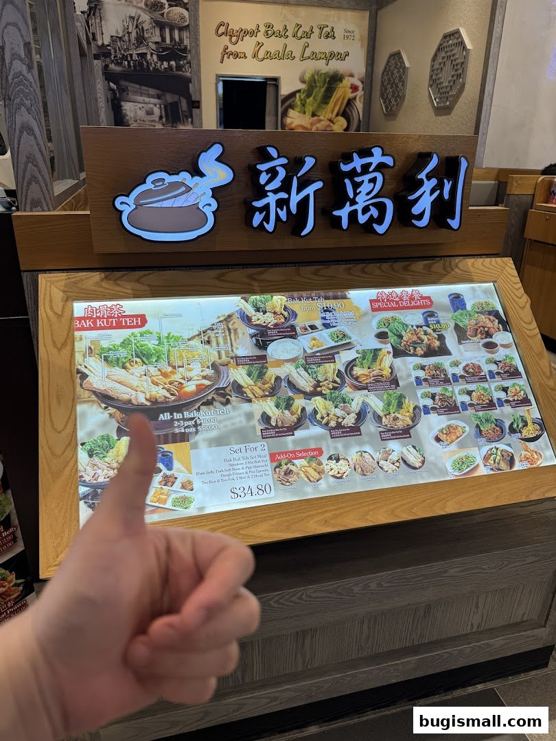 A menu display for New Manlee Bak Kut Teh, featuring various sets and dishes.
