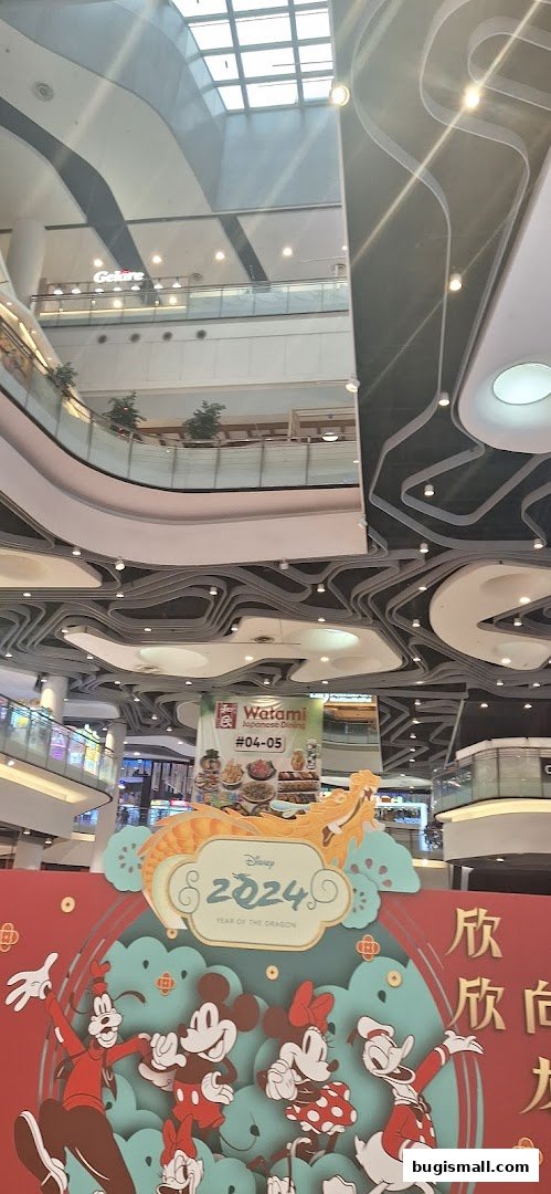 A festive Disney Lunar New Year display with characters and a Watami Japanese Dining advertisement.