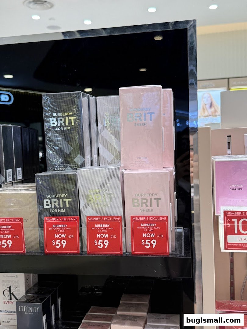 Display of Burberry Brit fragrances for men and women with promotional pricing.