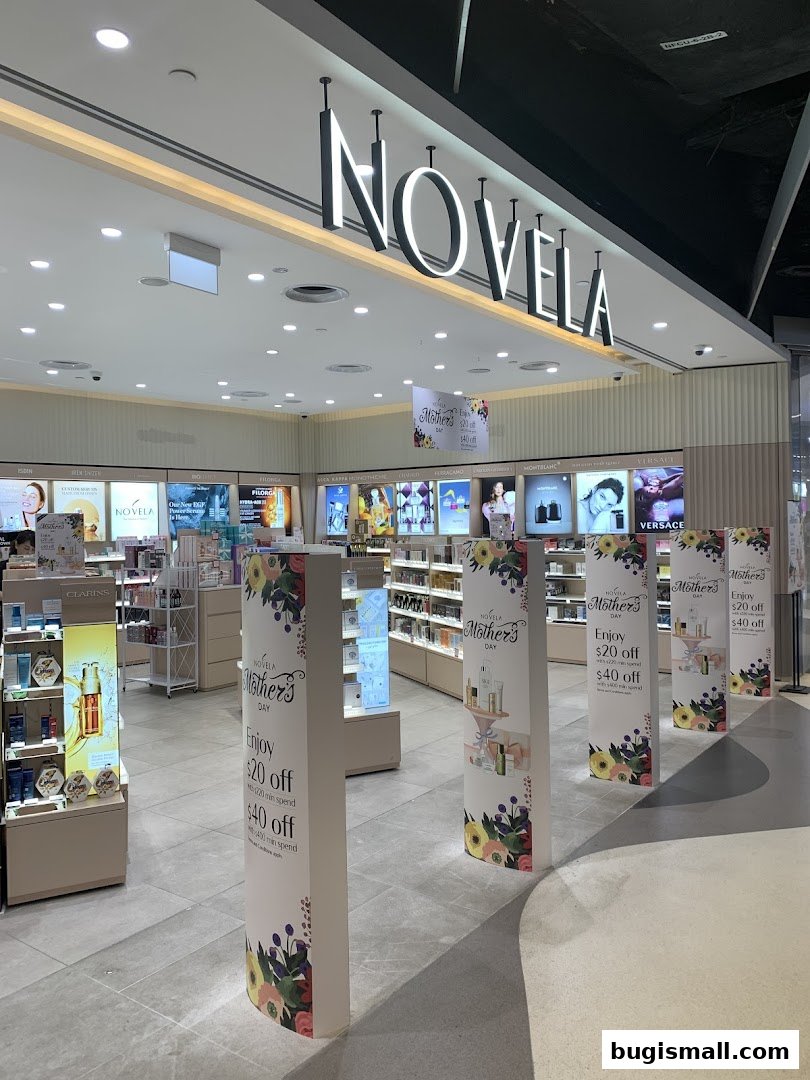 The interior of a Novela beauty store with displays of cosmetics and promotional signage.