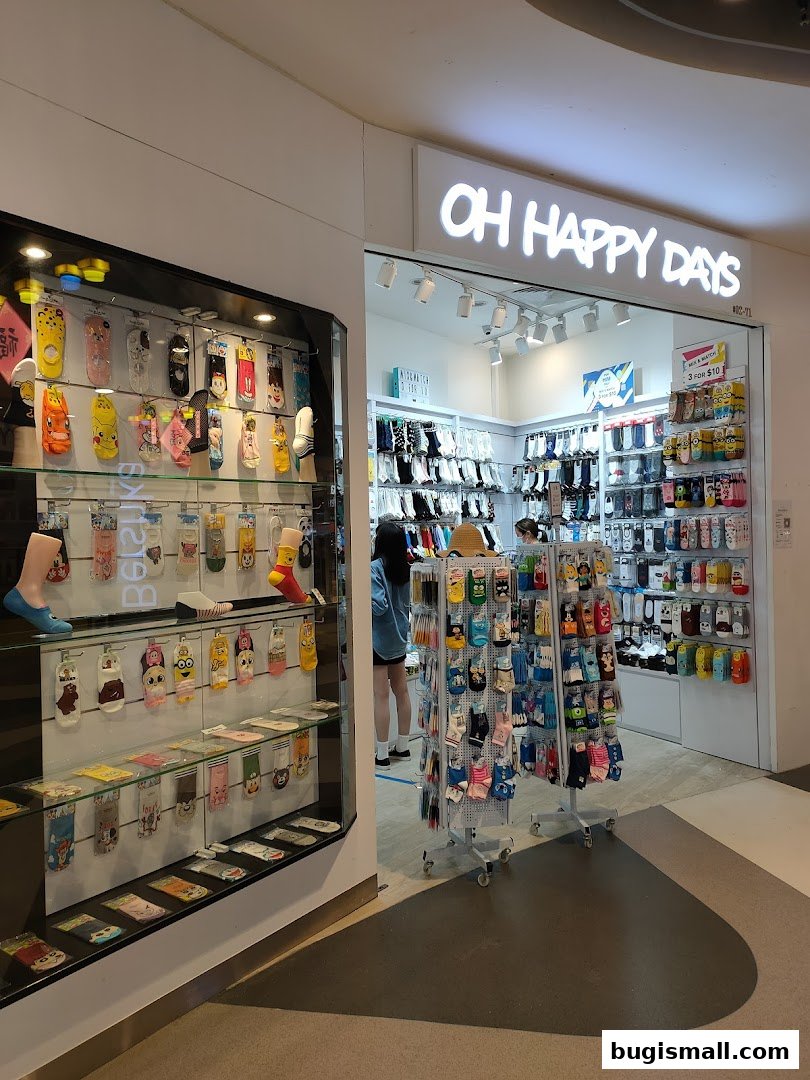 A shop called Oh Happy Days displays a wide variety of colorful socks in display cases and on racks.