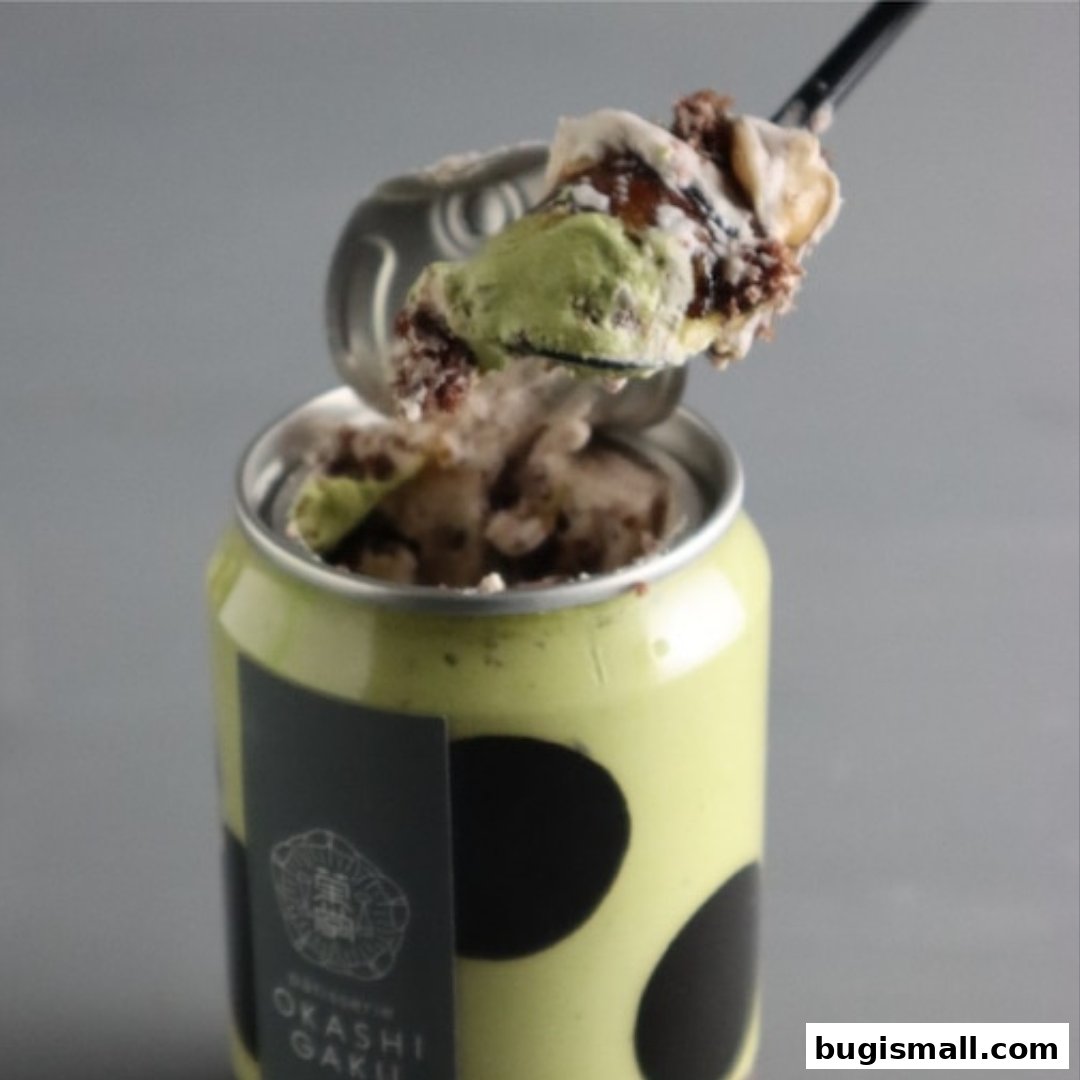 A spoon scoops a dessert from a can labeled Okashi Gaku.
