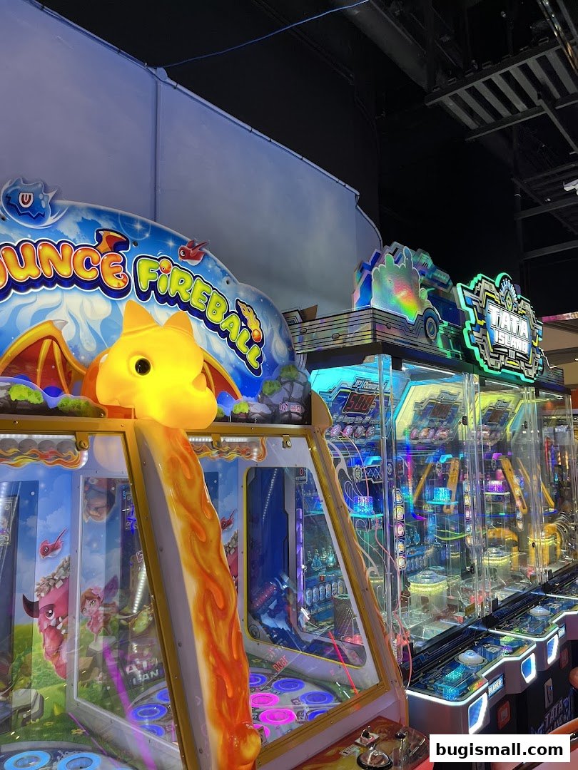 Brightly lit arcade games with colorful graphics and flashing lights.
