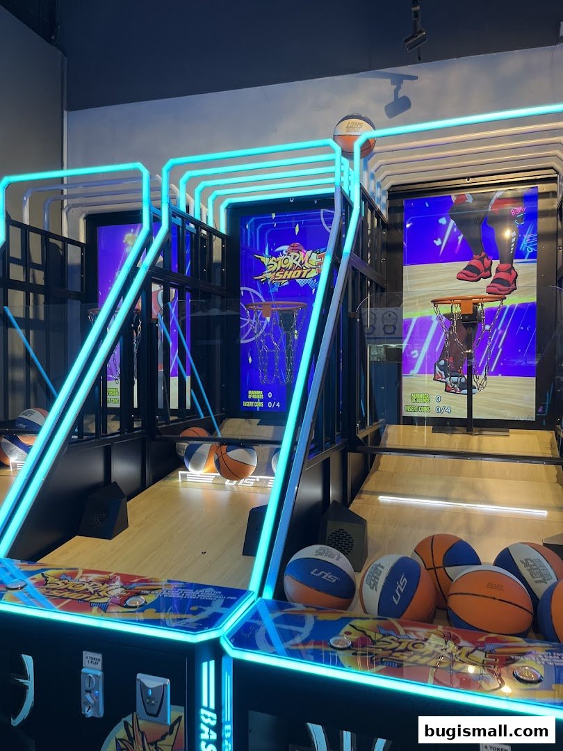 Basketball arcade game machines with neon lights and basketballs.