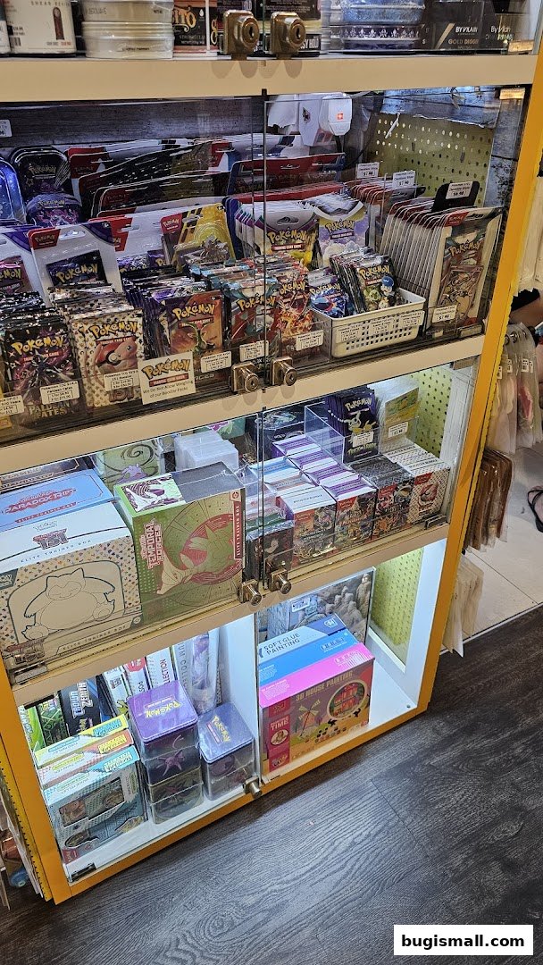 A display cabinet filled with various Pokemon trading card packs and boxes.