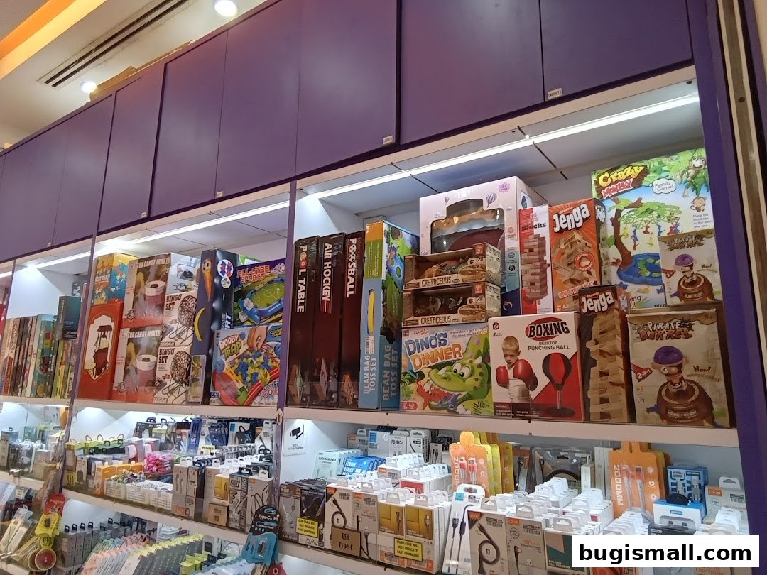 Shelves filled with various board games and electronic accessories in a retail store.