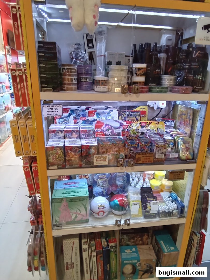A display shelf filled with various collectible items, including trading cards and themed merchandise.