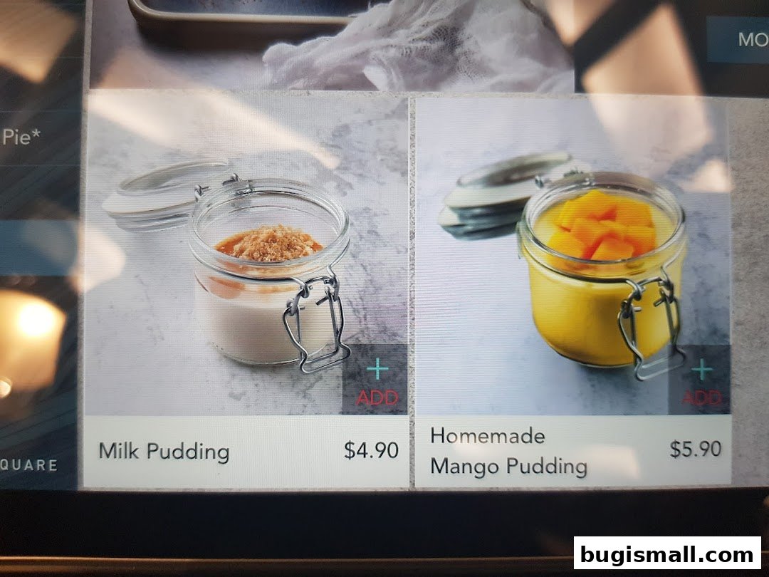 Two jars of pudding, one milk and one mango, with prices displayed.