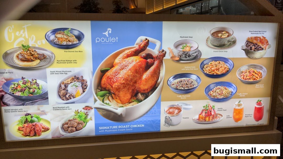 A menu board showcasing various dishes from Poulet, featuring roast chicken and other French-inspired meals.