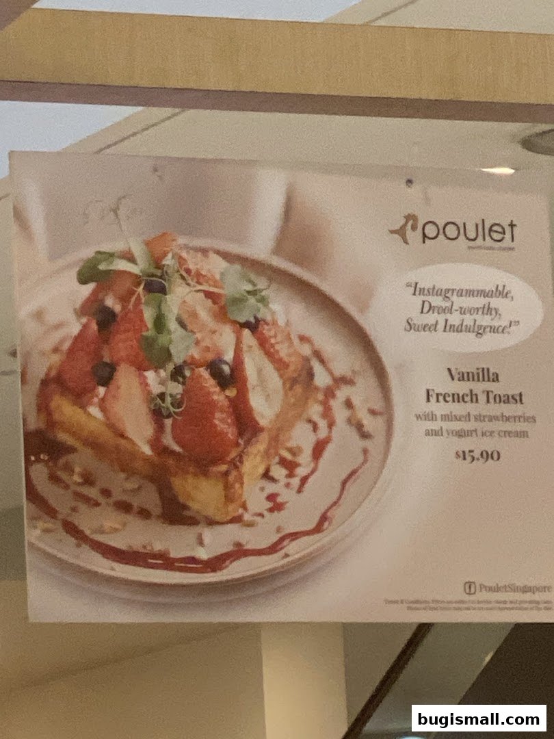 A delicious-looking Vanilla French Toast with strawberries and yogurt ice cream.