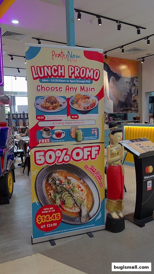 A promotional banner for Pratunam PLUS by Soi Thai Soi Nice featuring lunch deals and a 50% off seabass offer.