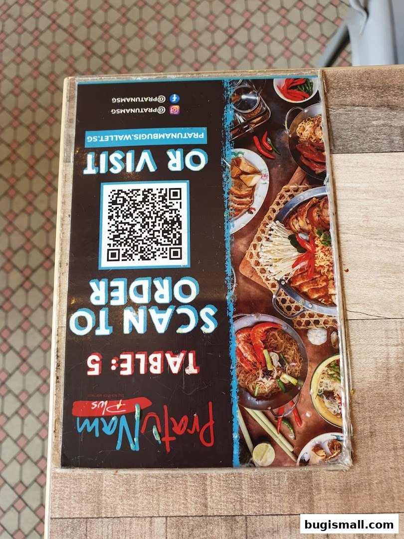 A menu card for Pratunam PLUS by Soi Thai Soi Nice with a QR code for ordering.