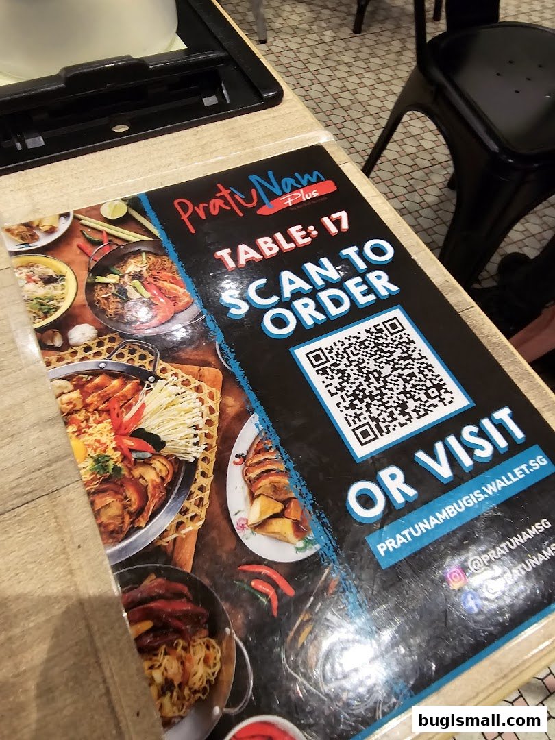 A table menu with a QR code for ordering at Pratunam PLUS by Soi Thai Soi Nice.
