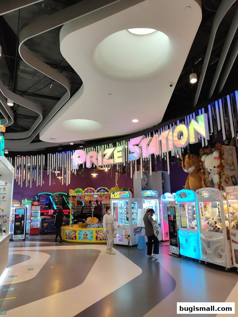 Interior of Prize Station arcade with various game machines and prizes.