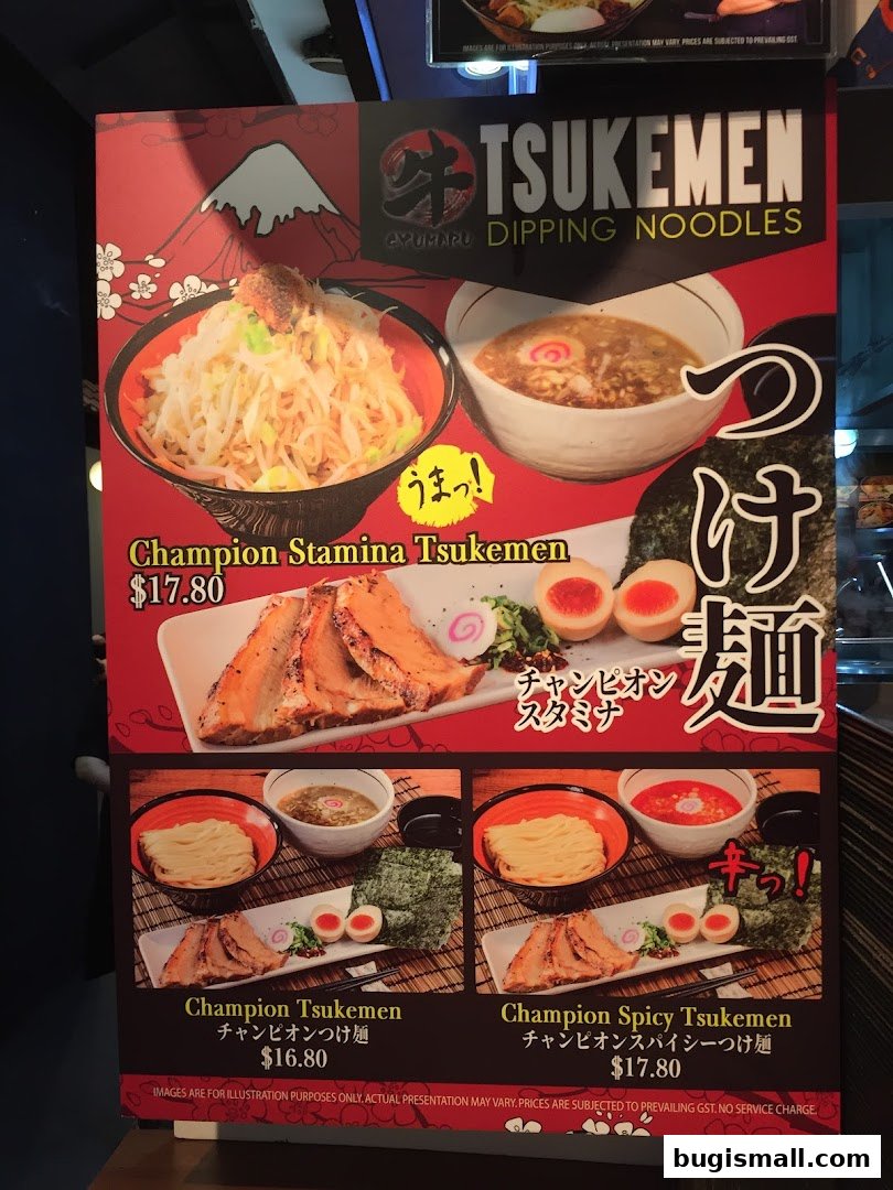 A menu board for Ramen Champion featuring various tsukemen noodle dishes with prices.