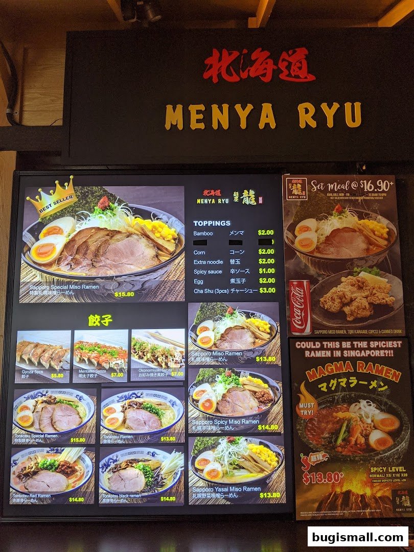 A digital menu board displaying various ramen dishes, gyoza, and set meals from Ramen Champion.