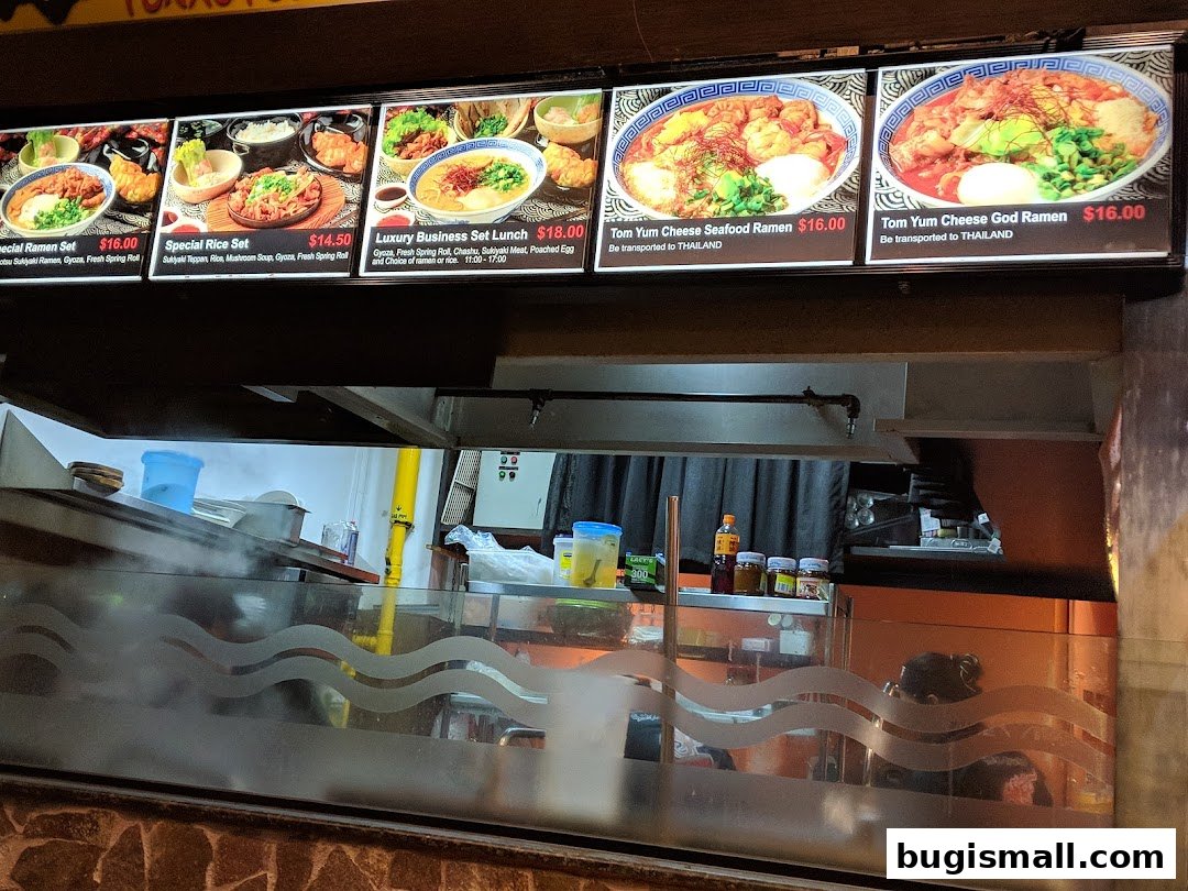 A menu board displaying various ramen dishes and set lunches with prices.