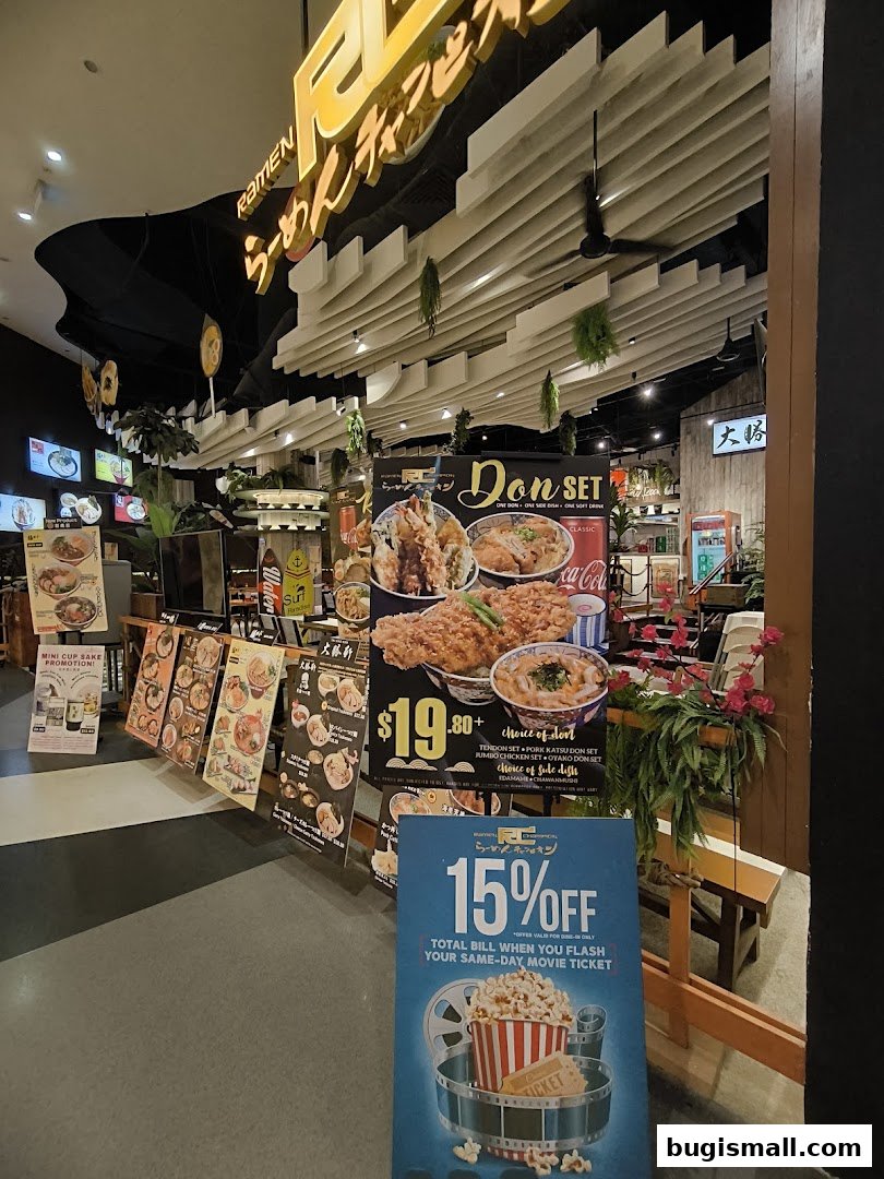 Ramen Champion shop front with various food promotions and a movie ticket discount offer.