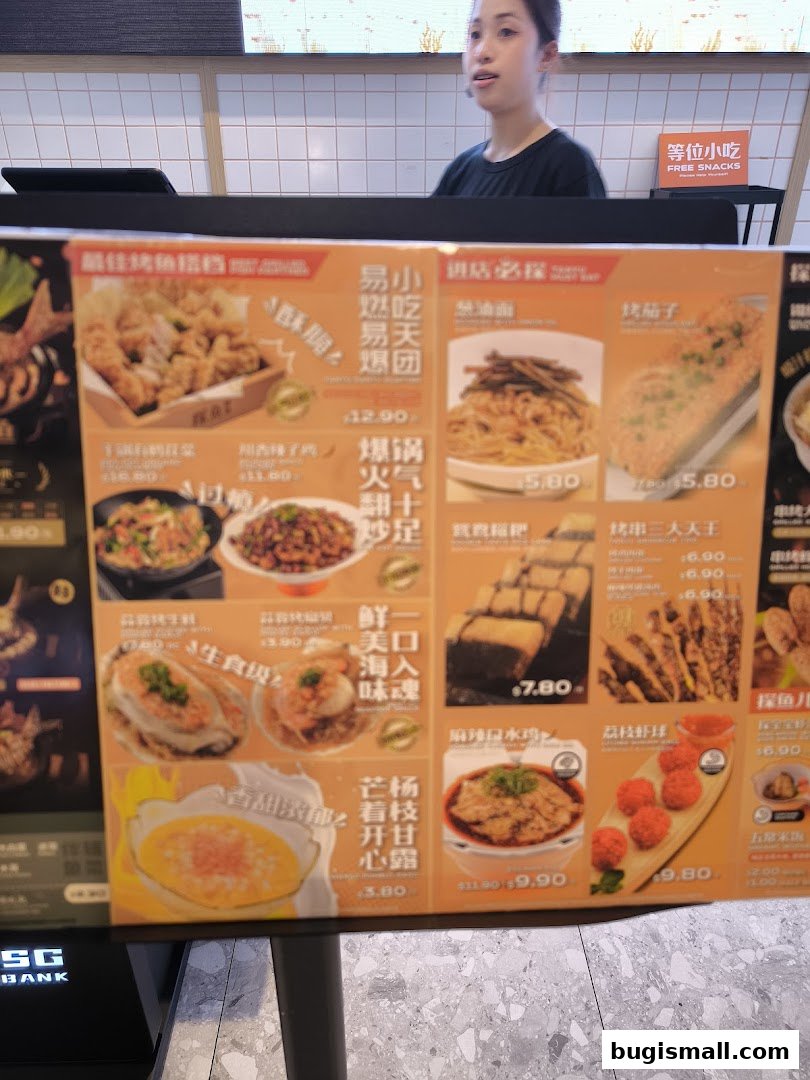 A menu board displays various food items with prices, including fried chicken, noodles, and snacks.