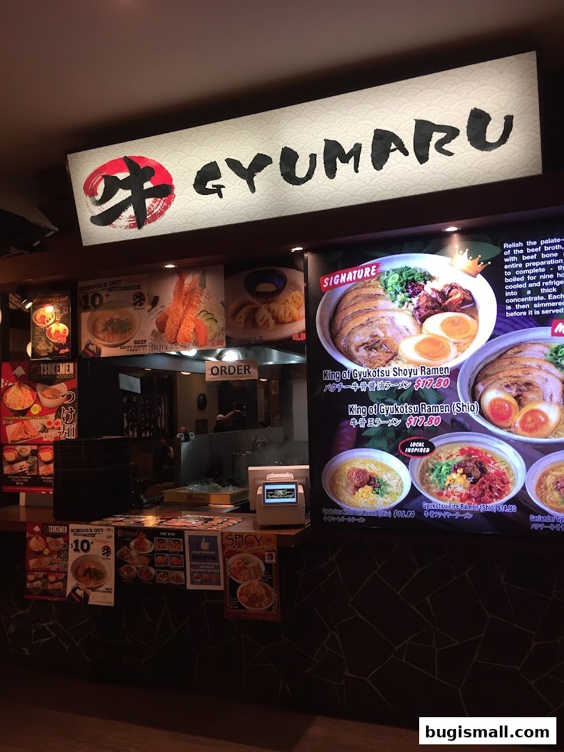A menu display for Gyumaru Ramen, showcasing various ramen dishes and prices.