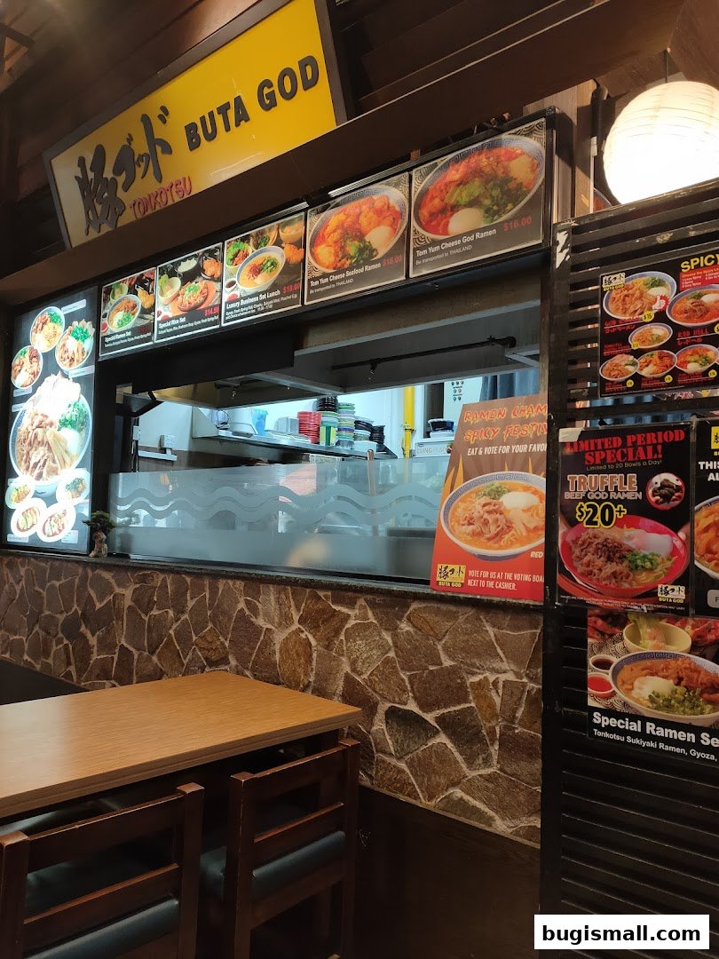 A display of ramen dishes and menu items at Ramen Champion.