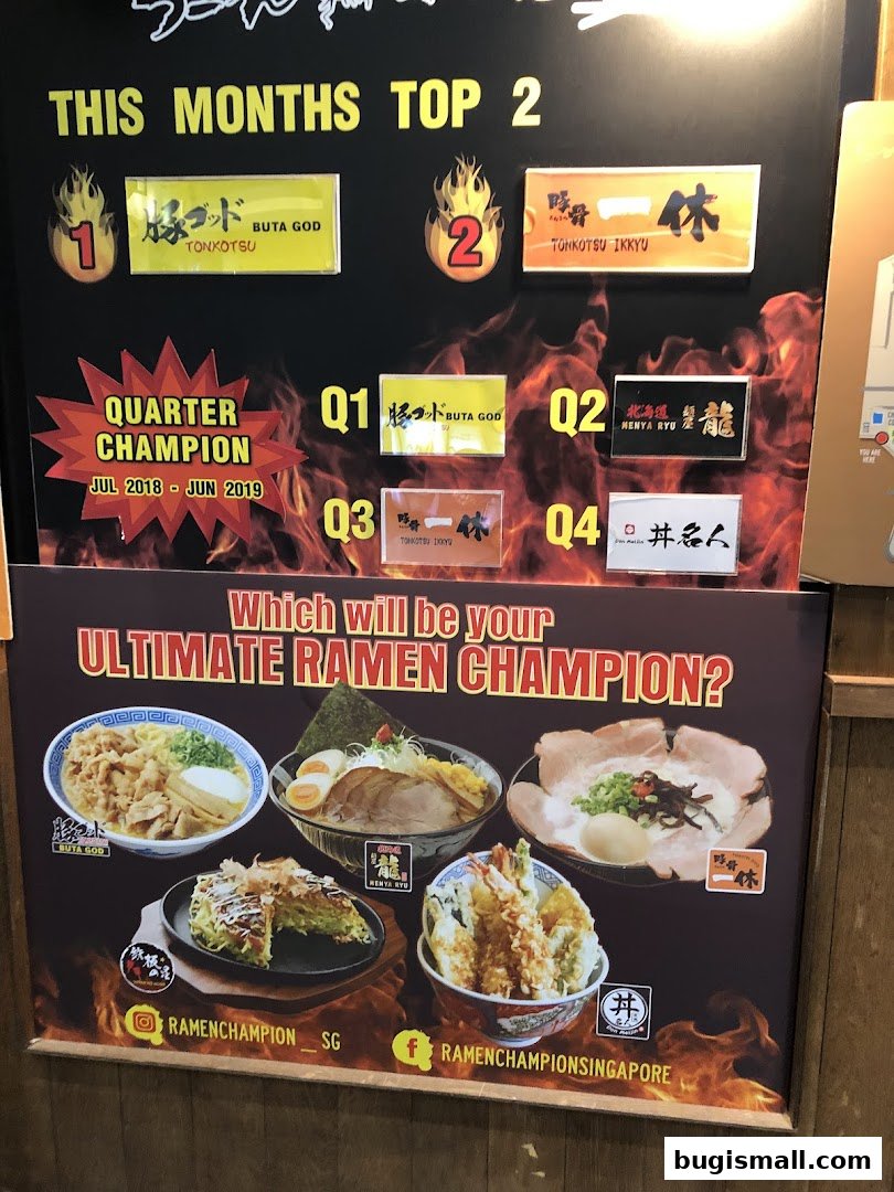 A promotional display for Ramen Champion featuring top ramen dishes and rankings.