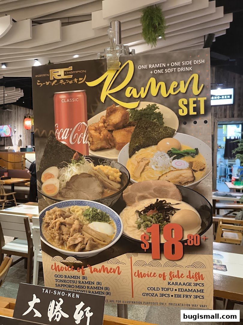 A promotional sign for Ramen Champion featuring a ramen set with a drink and side dish.