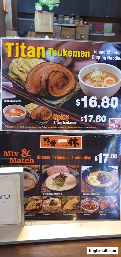 A menu board showcasing different ramen dishes and side options at Ramen Champion.