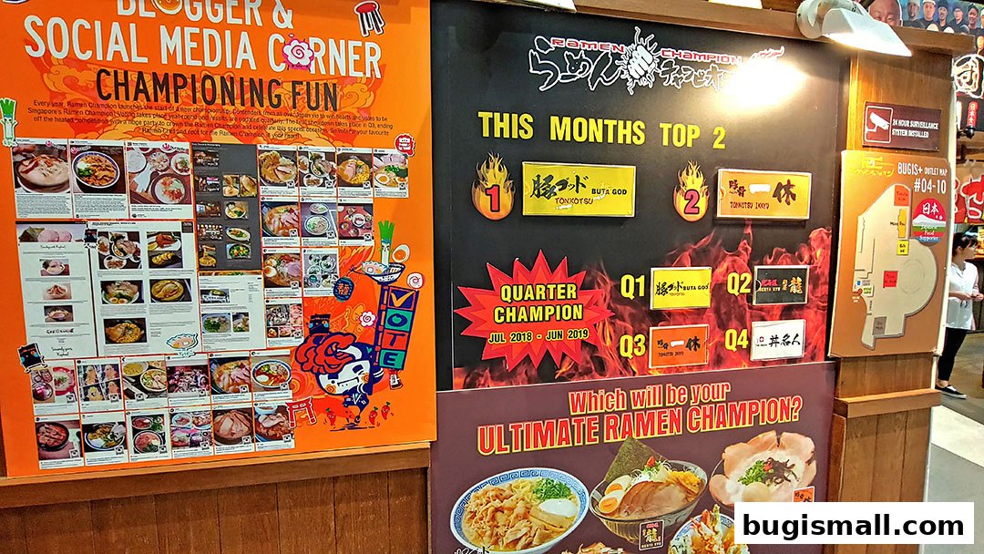 A display board showcasing popular ramen dishes and a voting campaign for Ramen Champion.
