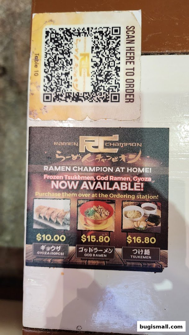 A sign for Ramen Champion advertises frozen Tsukemen, God Ramen, and Gyoza, with prices and images.