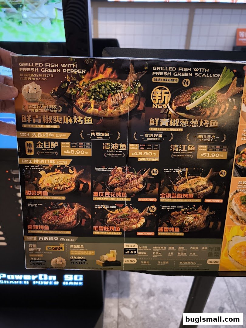 A menu from Ramen Champion featuring various grilled fish dishes and side dishes.