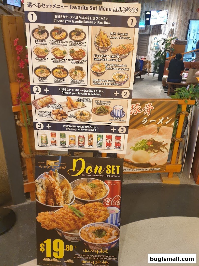 A menu board for Ramen Champion featuring set meals with ramen, rice bowls, side dishes, and drinks.