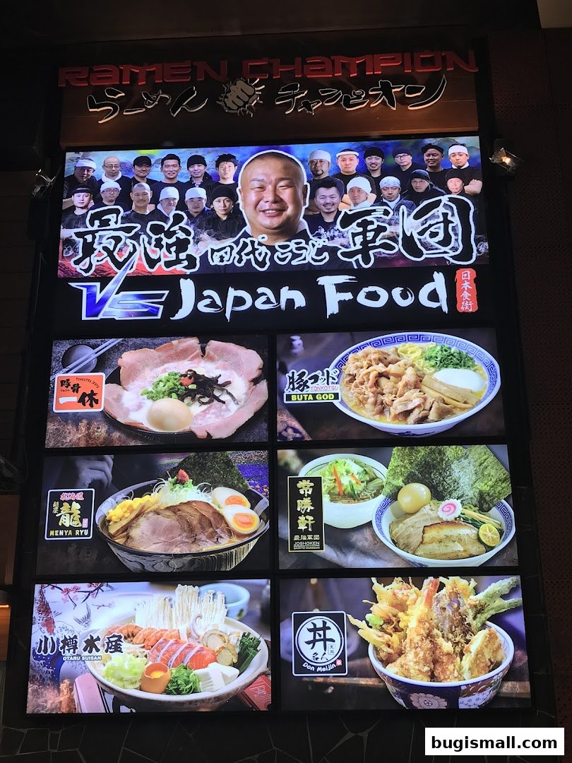 A brightly lit display board showcasing various ramen dishes and Japanese food from Ramen Champion.