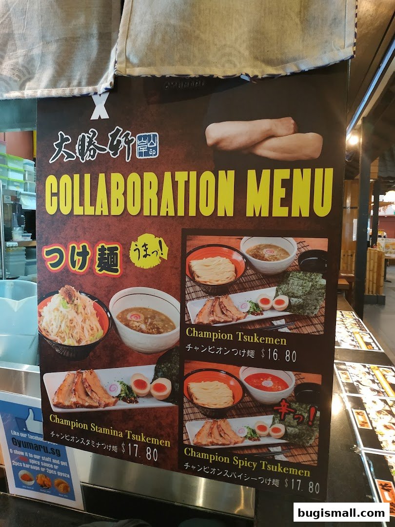 A menu board showcasing a collaboration ramen menu with various tsukemen dishes.