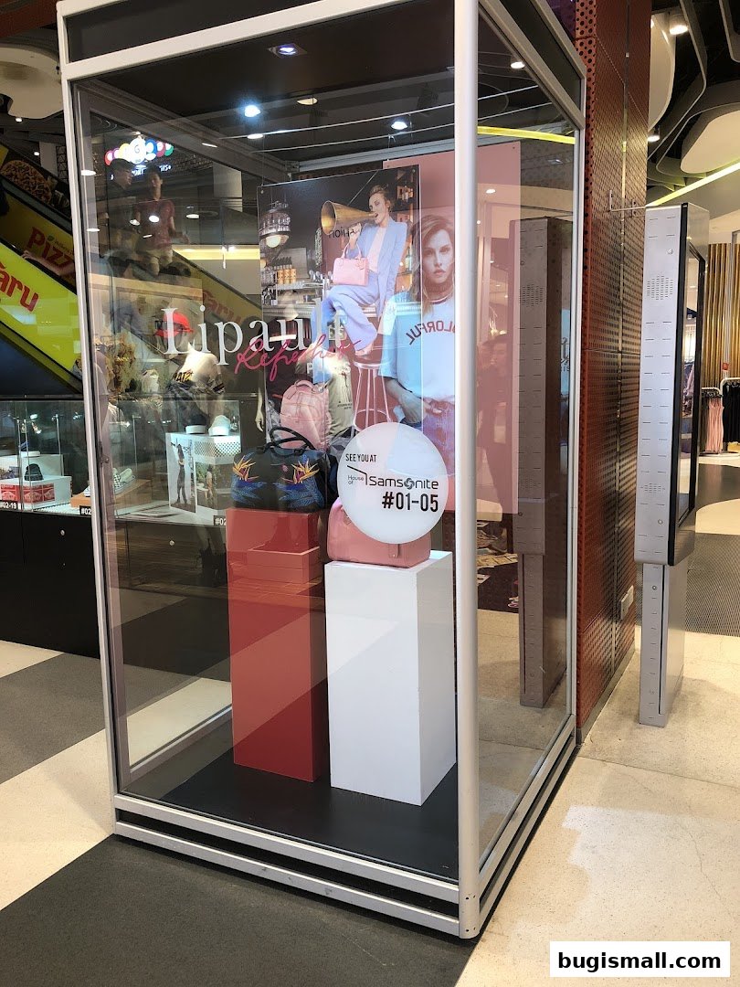 A display window showcasing Samsonite bags and lifestyle imagery.