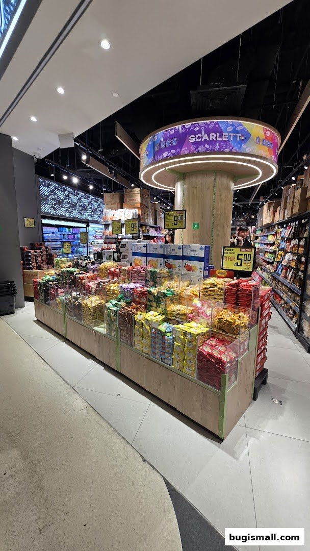 Interior of Scarlett Supermarket with a large display of snacks and packaged goods.
