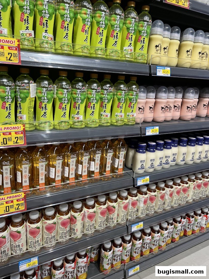 Shelves stocked with various bottled beverages, including teas and milk drinks.