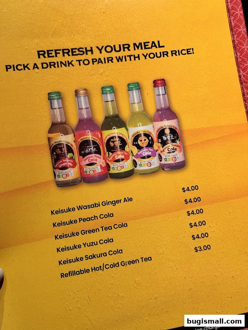 A menu page showcasing various flavored colas and green tea from Scrambled Egg Rice Keisuke.