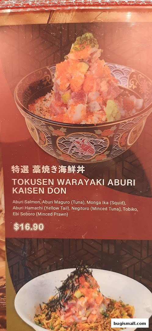 A close-up of a menu item featuring a seafood donburi with various toppings.