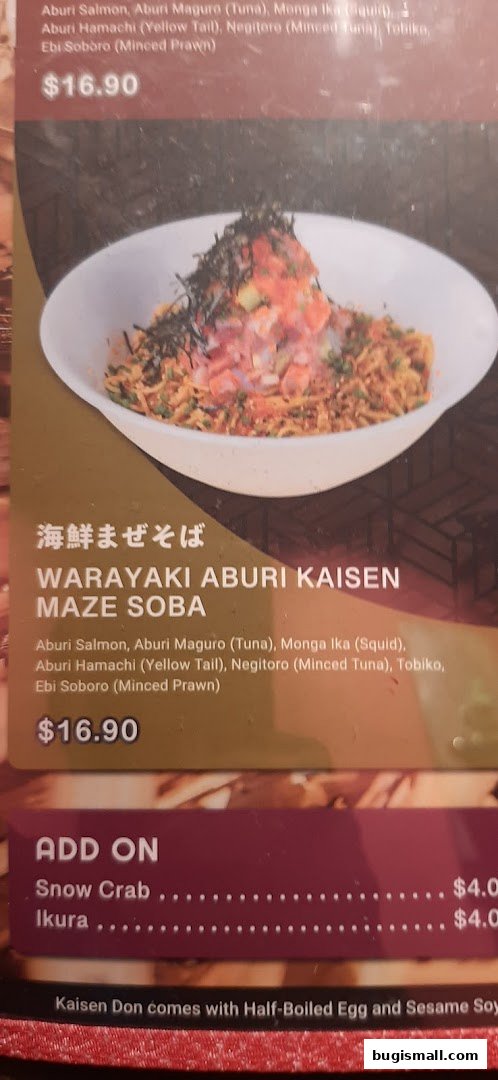 A close-up of a menu item featuring a bowl of noodles with various seafood toppings.