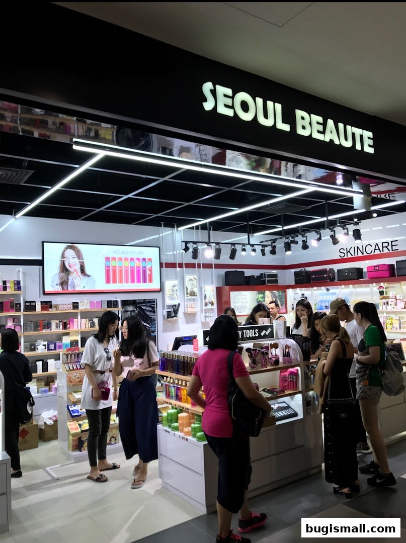 Customers browse beauty products inside the brightly lit Seoul Beaute store.