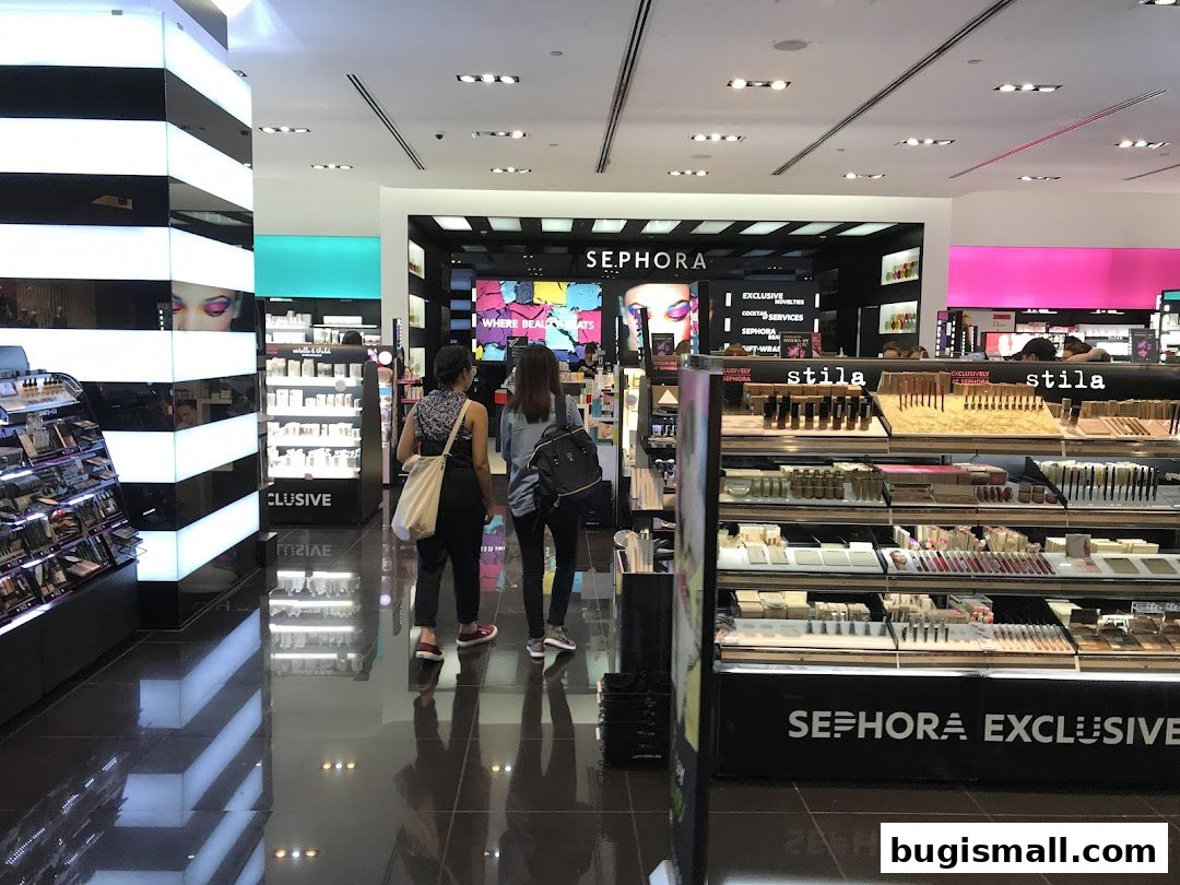Interior view of a Sephora store showcasing makeup products and displays with shoppers.