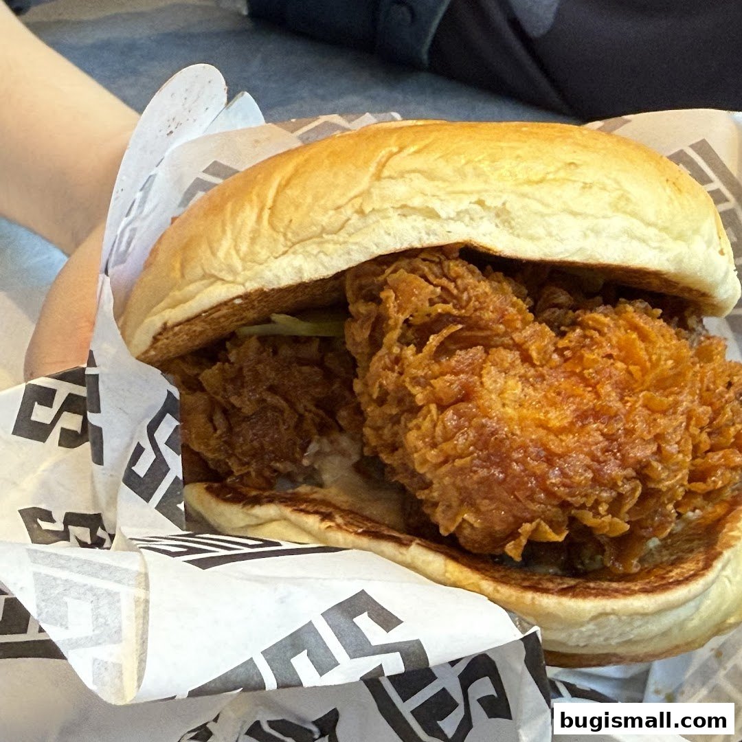 A close-up shot of a delicious fried chicken sandwich from SIDES.