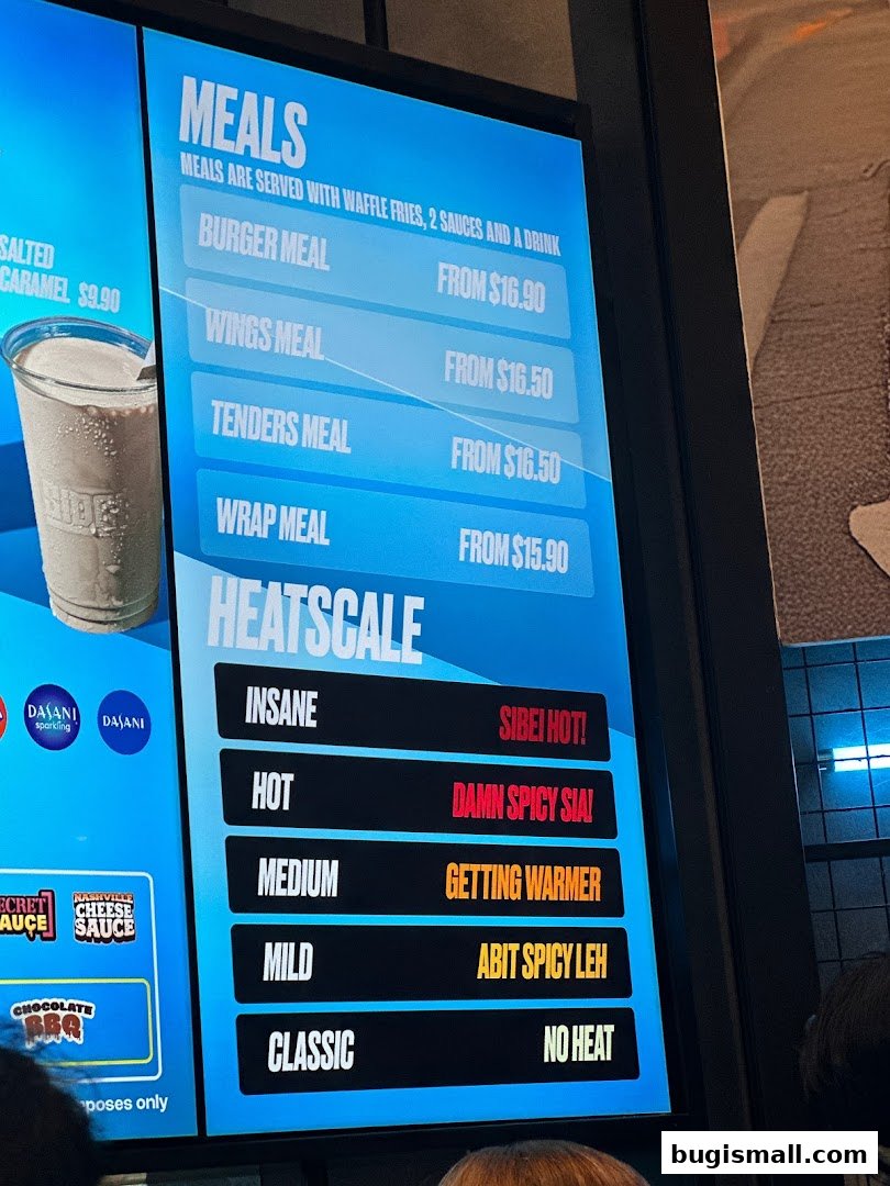 A digital menu board displaying meal options and a heat scale for spice levels.