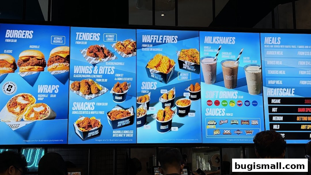 A digital menu board displaying various food and drink options from SIDES.