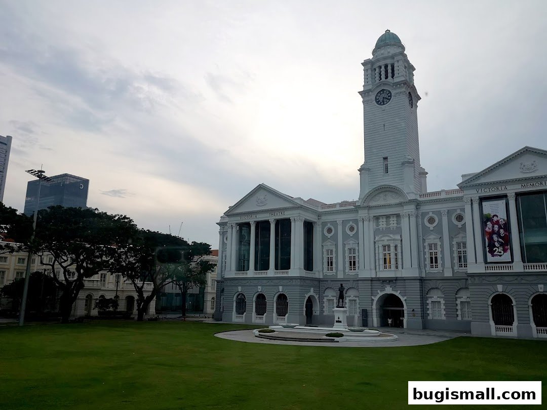 The grand Victoria Theatre and Concert Hall with a clock tower and manicured lawn.
