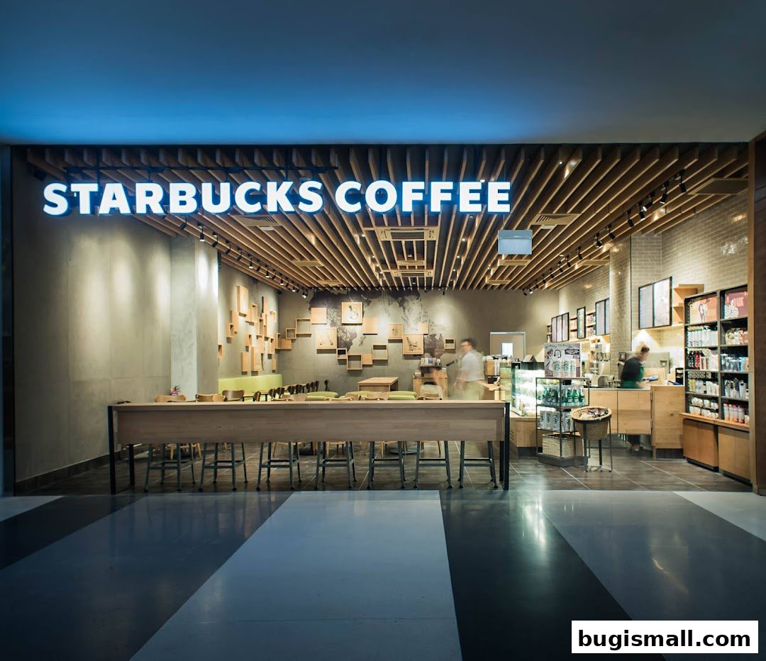 Interior view of a Starbucks coffee shop with seating and a counter.