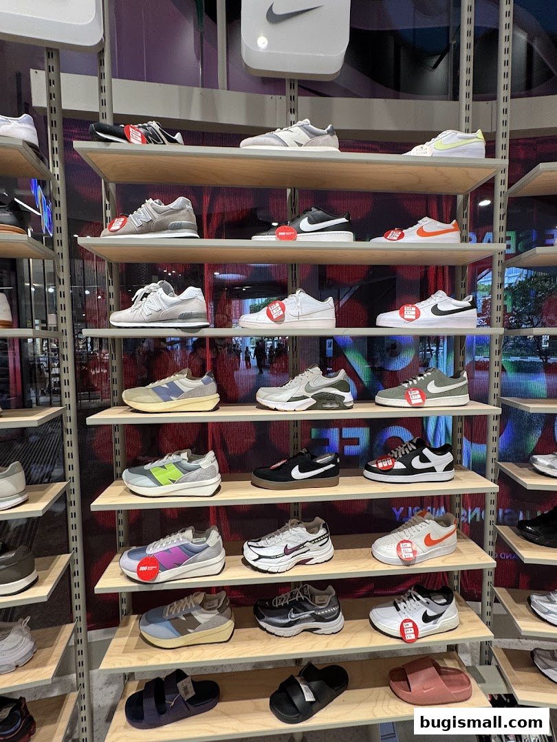 Shelves filled with various athletic shoes and sandals from popular brands like Nike and New Balance.